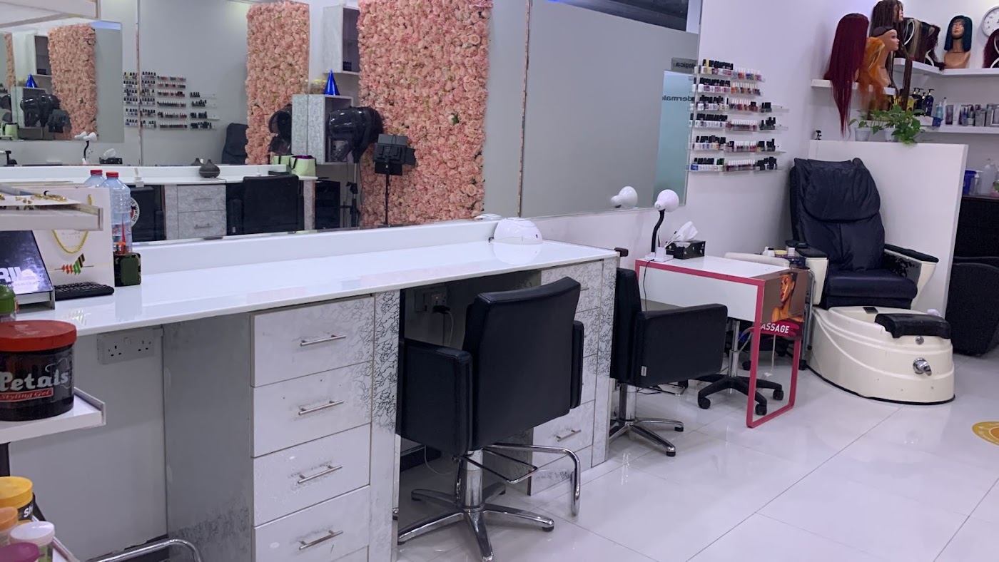 Clean white styling stations at the salon